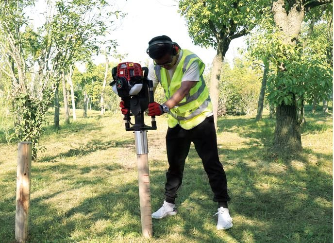 Forestry – petrol post driver at work